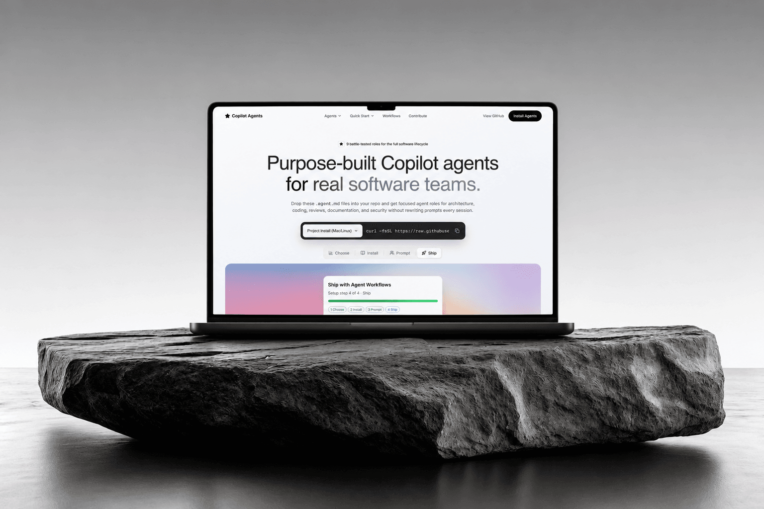 The Copilot Agents showcase site on a laptop resting on a slab of stone